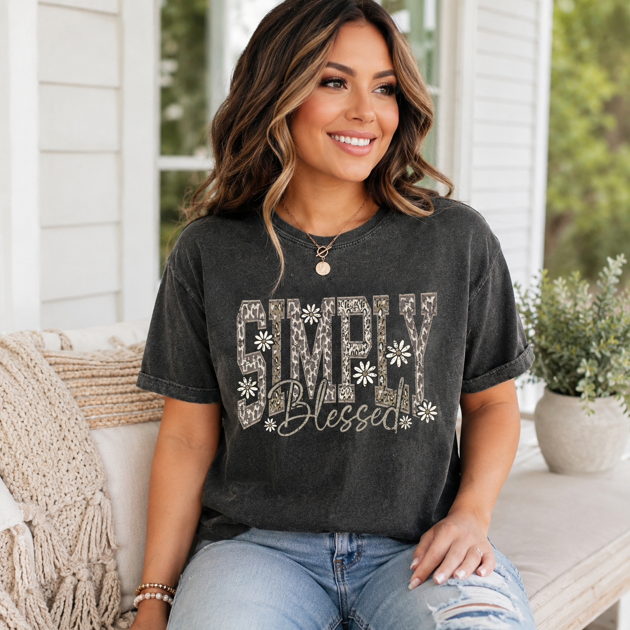 Lifestyle mockup of a black shirt with a faith inspired ready to press dtf graphic that says Simply Blessed with floral accents.