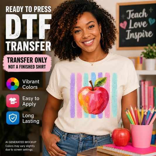 Person wearing a t-shirt with a colorful apple design, surrounded by educational items.