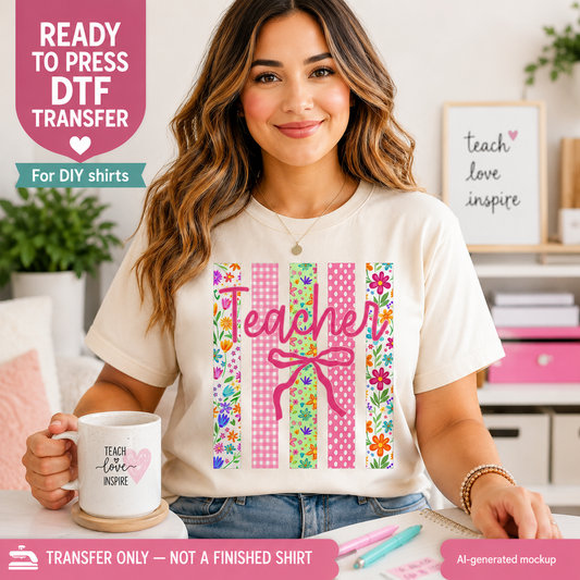 Woman wearing a 'Teacher' themed t-shirt with decorative elements, holding a mug in a classroom setting.