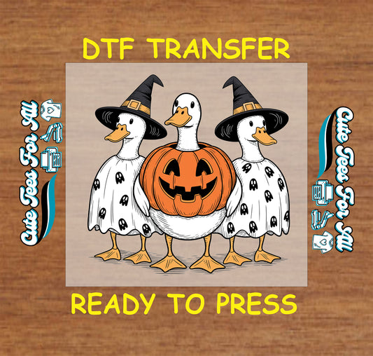 DTF transfer with three ducks dressed for Halloween: two in ghost costumes with witch hats and one in a pumpkin

