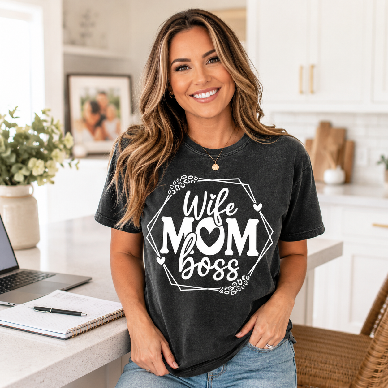 Lifestyle mockup of a dark gray shirt featuring a white Wife Mom Boss ready to press dtf graphic with hearts, leopard accents, and geometric frame.